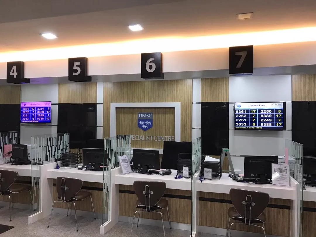 Numbered service counters with wall-mounted queue displays